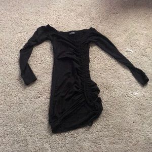 Black off the shoulder dress.